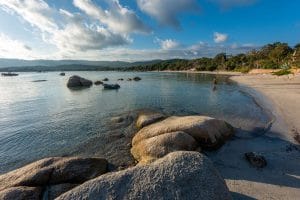Santa Giulia beach with shallow turquoise water and light sand